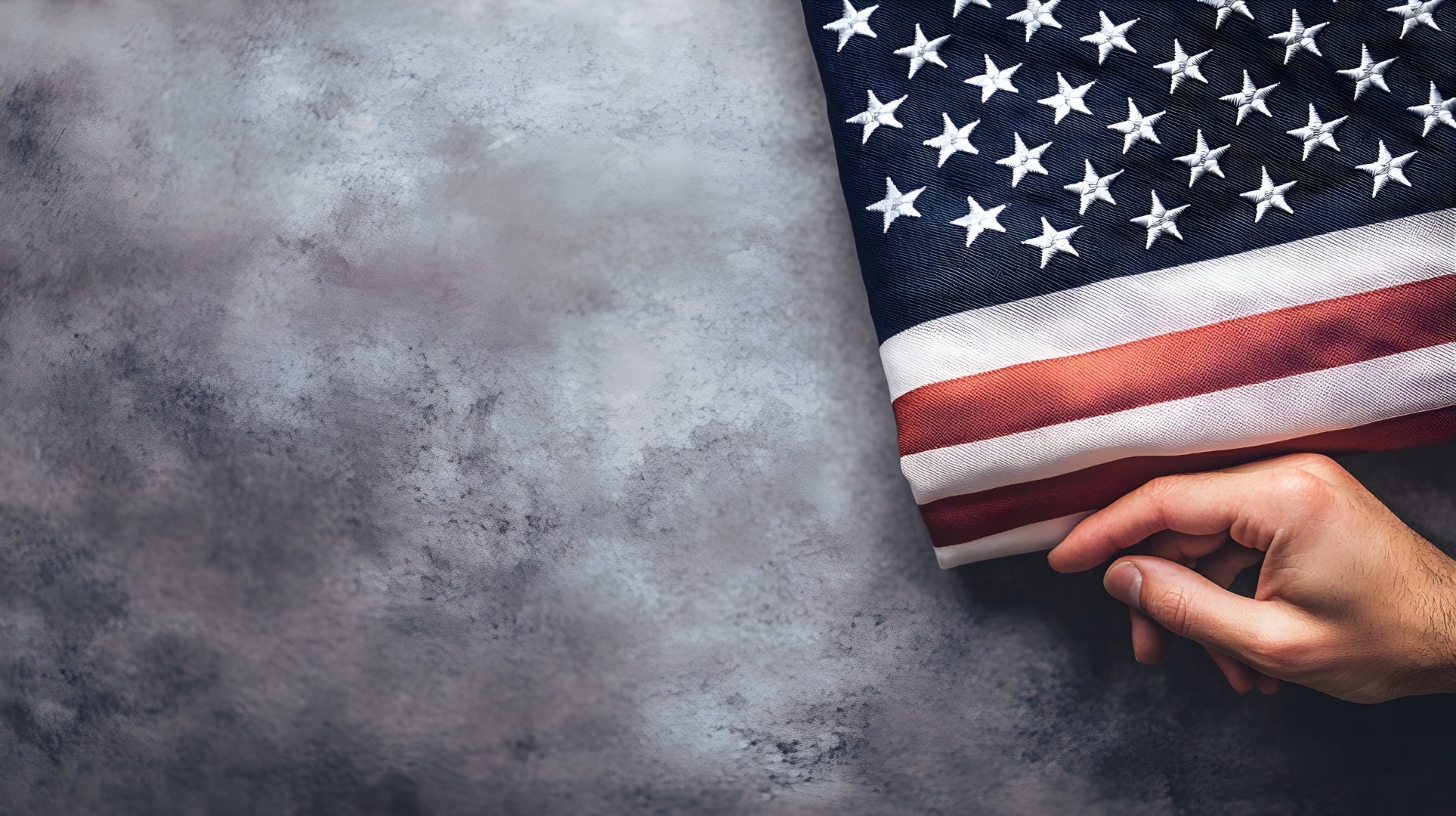 Weathered hands holding a folded American flag — For Those Who Serve
